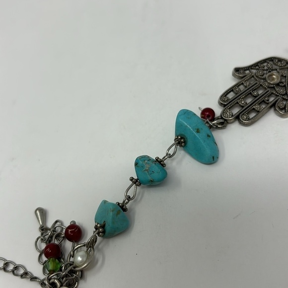 Fatima's hand bracelet with silver-colored turquoise stones and red Stones. - Picture 6 of 6